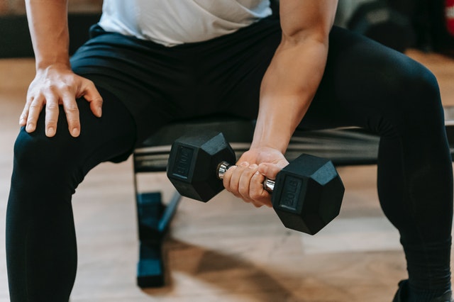 Athlete using a dumbbell for strength training.